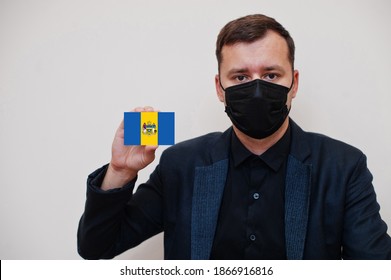 American Man Wear Black Formal And Protect Face Mask, Hold Philadelphia Flag Card Isolated On White Background. USA Cities Coronavirus Covid Concept.