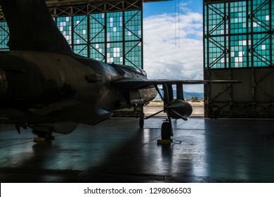 American Military Bomber Aircraft With Bombs Parked In Airport Base Hangar Ready For Flight Attack