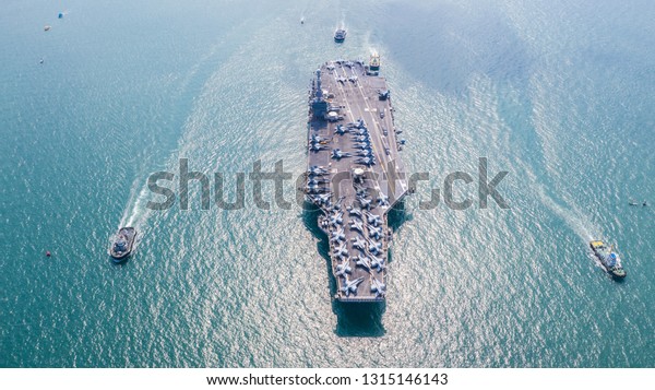 American navy aircraft carrier, USA navy ship
carrier full loading airplane fighter jet aircraft, Aerial view
army navy nuclear ship carrier full fighter jet aircraft concept
technology of
battleship.