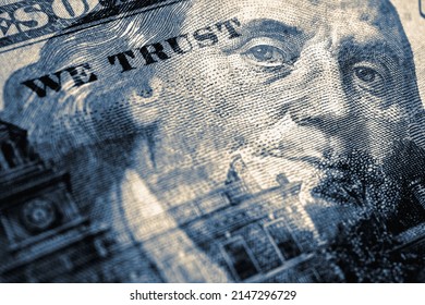American paper money. 100 dollar bill with portrait of Benjamin Franklin in focus. US banknote closeup. Blue tinted illustration. Government debt and USA dollars. Bonds and treasuries. We trust