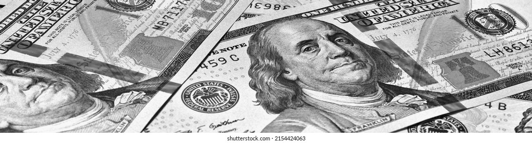 American paper money. 100 dollar and other US bills. Black and white banner or header. Savings economy and the USA dollar. National debt and Treasury