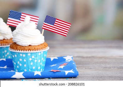 American patriotic holiday cupcakes on wooden table - Powered by Shutterstock