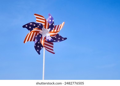 American Pinwheel in Blue Sky. American independence day - Powered by Shutterstock