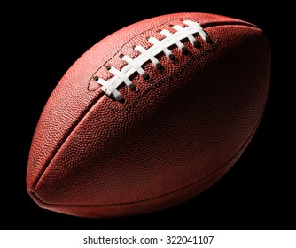 American Pro Football With Lower Half In Shadow Isolated On Black Background