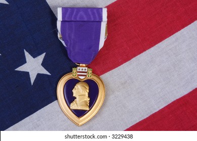 American Purple Heart Medal on a USA red white and blue  Flag Background.