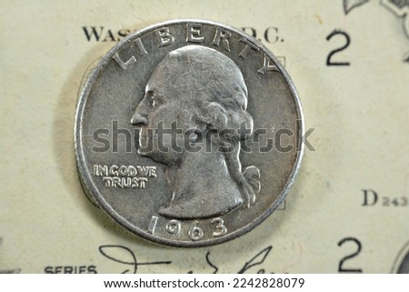 American quarter dollar coin, 25 twenty five cents series 1963 features George Washington, the founding father and 1st president of United States of America, old USA vintage retro coin on USD bill