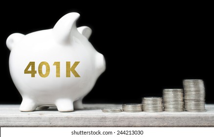 American retirement savings concept with piggy bank and coins against black background