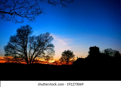 American Revolutionary War Soldier Housing Wood Cabin Encampment House And Trees Silhouette At Sunset At Valley Forge National Historical Park Military Camp  Near Philadelphia In Pennsylvania