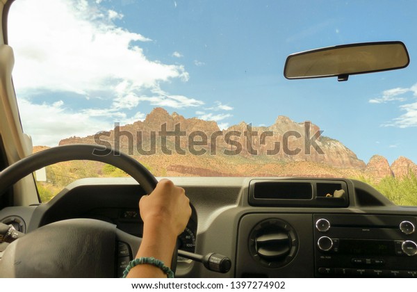 American road trip. Driving in the Zion National\
Park (Utah - USA)