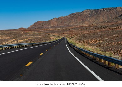 American Roadtrip. Landscape With Orange Rocks, Sky With Clouds And Asphalt Road In Summer