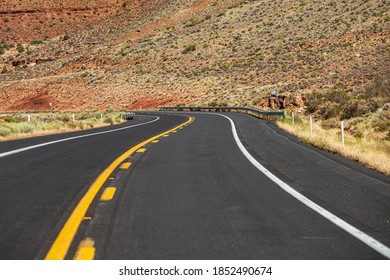 American Roadtrip. Landscape With Rocks And Asphalt Road In The Evening In Summer