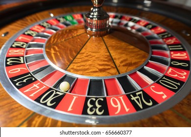 American Roulette wheel with a ball in the number '20'