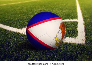 American Samoa flag on ball at corner kick position, soccer field background. National football theme on green grass. - Powered by Shutterstock