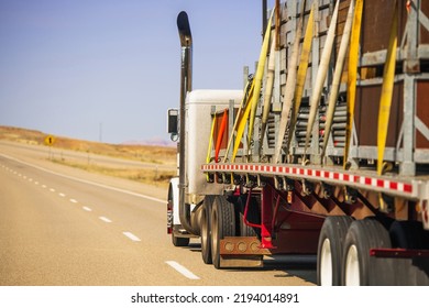 American Semi Truck Trailer Oversize Cargo Secured With Lashing Straps. Heavy Duty Transportation Safety Theme. 