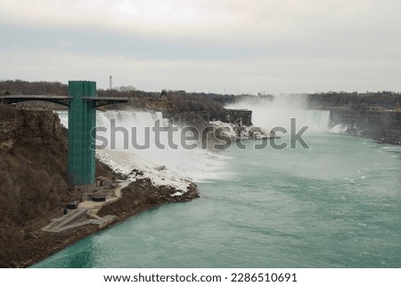 The American side of Niagara Falls with a viewing platform taken from the Rainbow Bridge