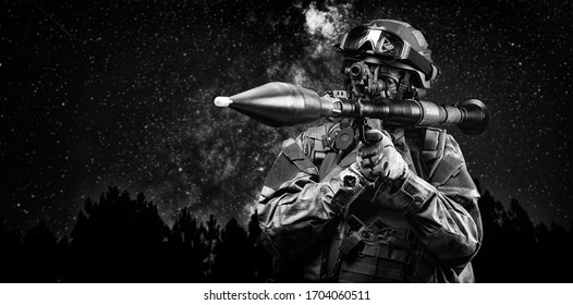 American Soldier Aims At The Sight Of An RPG Against The Background Of A Night Forest. The Concept Of Military Special Operations. Mixed Media