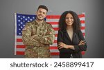 American soldier and businesswoman stand confidently in an office with the us flag.