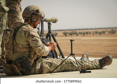 American Soldier Monitors ISIS Fighters Through The Binoculars.
Aleppo, Syria 15 September 2017