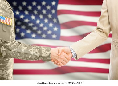 American soldier in uniform and civil man in suit shaking hands with national flag on background - United States - Powered by Shutterstock