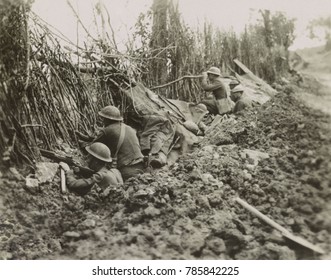 American soldiers in front line trench during the Meuse-Argonne Offensive, France, World War1. They are about 1200 yards from the German line on Oct. 3, 1918 as they occupy a camouflaged trench abando