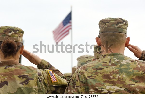 American Soldiers Saluting US\
Flag