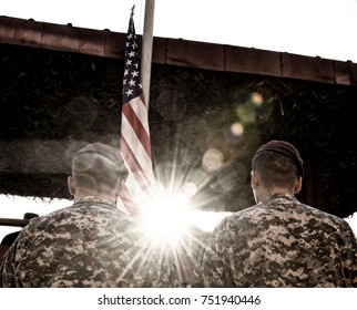 American Soldiers And US Flag With Sunlight. Veteran Day. Memorial Day.