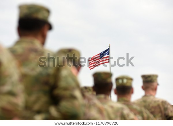 American Soldiers and US\
Flag. US troops