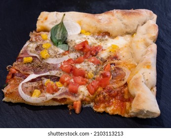 American Style Thin Crust Square Pizza Slice With Tomatoes, Bacon, Onion And Corn