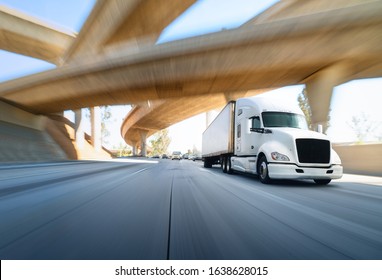 American Style Truck On Freeway Pulling Load. Transportation Theme. Road Cars Theme. Truckers Heaven. Trailer Passing The Bridge