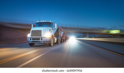 American Style Truck On Freeway Pulling Load At Night. Transportation Theme. Road Cars Theme. Truckers Heaven. Trailer Passing The Bridge