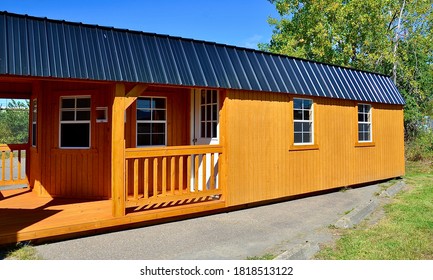 American Style Wooded Shed, Modern Large Size With Porch. A Shed Is Typically A Simple, Single-story Roofed Structure In Backyard Or On An Allotment That Is Used For Storage, Hobbies, Or As Workshop. 