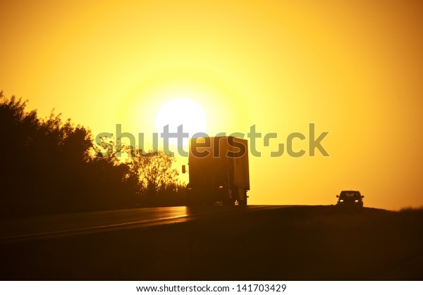 American Sunset Highway. Truck on the\
Highway. Transportation Photo\
Collection.