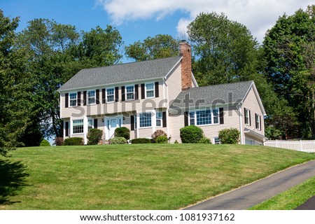 American traditional Colonial house front view in summer