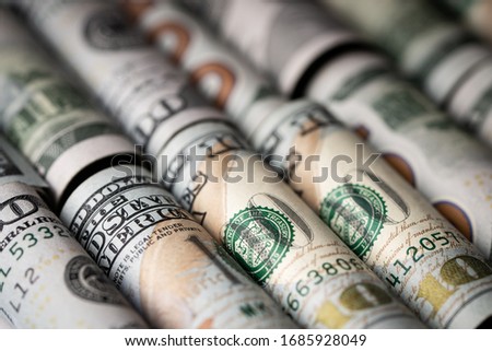 American US dollar bills in rolls isolated on white background for business and financial concept
