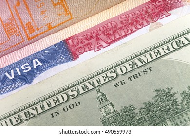 The American Visa On Page Of The International Passport And US Dollars, Closeup

