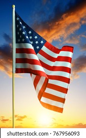 American Waving Flag In The Sunset. 