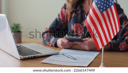 American woman consular officer giving passport to male immigrant, work visa, citizenship. Visa Application online form immigration concept. Visa approval.