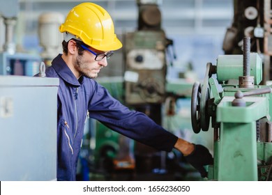 American Worker Young Man.engineer Smiling For Service Maintenance Fix Machine In Heavy Industy With Safty Suit And Helmet.