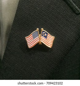 American X Malaysia Flag Lapel Pin On A Blazer Symbolizes Patriotism.