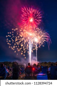 American's Sitting In Lawn Chair Watching Fourth Of July Fireworks.