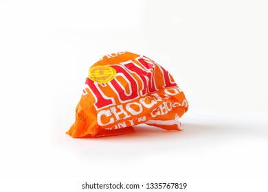 AMERSFOORT, THE NETHERLANDS – March 11 2019: Isolated Crumpled Ball Wrapper Of A Slave Free Chocolate Bar (Caramel Sea Salt) By Tonys Chocolonely - Dutch Brand of Fair Trade Chocolate Products