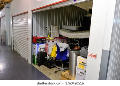 Amersfoort, The Netherlands,June,20,2020:Indoor Storage Unit With Open Door And Household Goods In A Self Storage Facility. Rental Storage Units