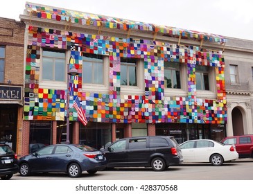 AMES, IA -25 MAY 2016- A Building Covered With A Colorful Knitted Quilt On Main Street In The Historic Downtown Of Ames, Iowa. 