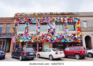 AMES, IA -25 MAY 2016- A Building Covered With A Colorful Knitted Quilt On Main Street In The Historic Downtown Of Ames, Iowa. 