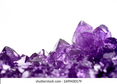 Amethyst crystals geode isolated on white background. Stock photo