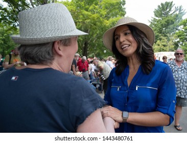 Amherst, N.H./USA - July 4, 2019: U.S. Rep. Tulsi Gabbard Greets A Voter During The Amherst July 4th Parade. 