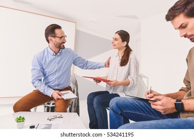 Amiable man encouraging young woman - Shutterstock ID 534241195