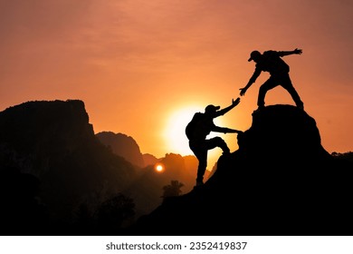 Amidst the echoing rays of sunlight, the mountain climber is extending a helping hand to pull their friend up to the mountaintop summit.