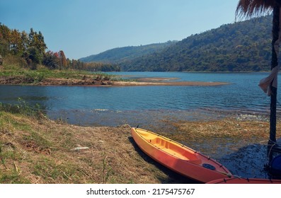 Amidst Serene Nature Of Khairabera Lake (reservoir For Irrigation Dam In Purulia District), A Kayaking Boat Moored Near Pier. Being A Popular Travel Port, Tourists Can Enjoy Various Water Sports.