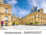 Amiens City hall Hotel de ville is a town hall neo-classical architecture style stone brick building with French flag in Amiens old historical city centre, Somme department, Hauts-de-France Region